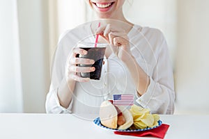 Close up of happy woman drinking coca cola