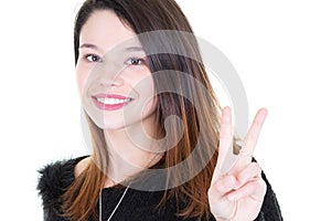 Close up of a happy woman making ok victory gesture