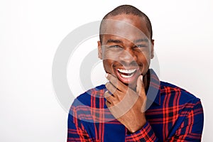 Close up happy young african american guy laughing against white background