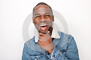 Close up happy young african american guy laughing with denim jacket