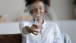 African American woman recommend water for body hydration photo