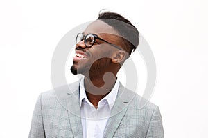 Close up happy young black businessman against isolated white background