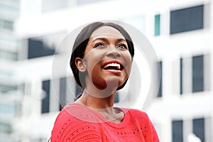 Close up happy young black woman in the city