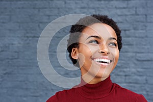 Close up happy young black woman laughing photo