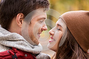 Close up of happy young couple kissing outdoors