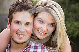 Close-up of a happy young couple outdoors. Shallow depth of field.