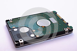 A close-up of a hard drive. The technology of data storage on the computer. Winchester