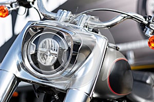 Close up of a Harley Davidson motorcycle headlight.