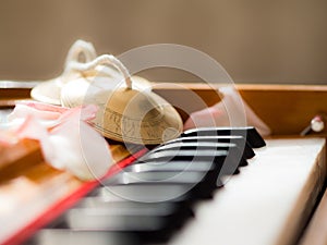 Close up of a harmonium with bells and petals photo