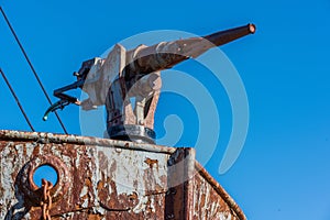 Close-up of harpoon gun in rusty whaler photo