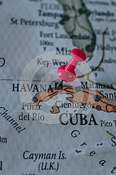 Close up of Havana pin pointed on the world map with a pink pushpin