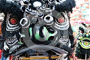 Close up, Head of The Chinese lion dance, traditional dance in Chinese culture which performers mimic a lion`s movements in a lio