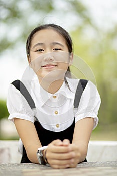 Close up head shop of asian teenager toothy smiling face outdoor