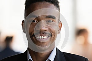Portrait of smiling young 30s african american businessman.