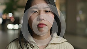 Close up head shot sad desperate Asian woman chinese korean japanese lady upset frustrated girl worry relations problem