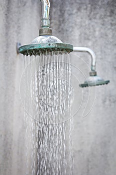 Close up on head shower while running water