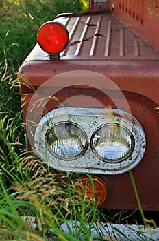 Close up of Headlight of an Abandoned Vintage and Rusty Truck