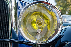 Close-up on headlight of antique car