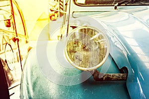 Close Up of Headlight Lamp Blue Vintage Classic Car