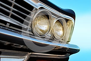 Close up of headlight lamp retro vintage car.