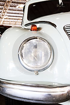 Close Up of Headlight Lamp Vintage Classic Car.