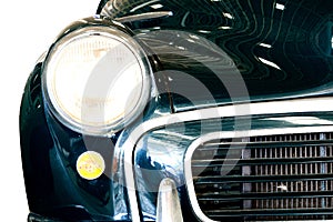 Close Up of Headlight Lamp Vintage Classic Car.