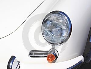 Close-up of headlights of white vintage car