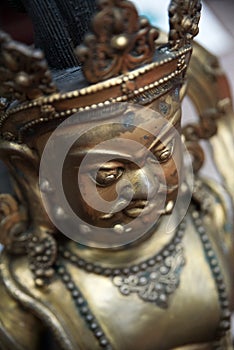 Close-up headshot of a Buddhist statue. selective focus