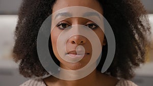 Close up headshot female portrait African American ethnic woman girl sad face serious beautiful lady calm looking camera