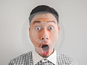 Close up of headshot of surprised and shocked face man.