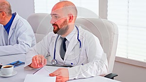 Close up of healthcare physician checking notes on clipboard