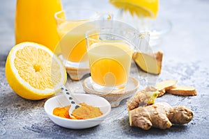 Close up of healthy Ginger Lemon Turmeric Shot - ideal to boost the immune system