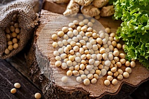 Close up healthy grains soybean on wooden background