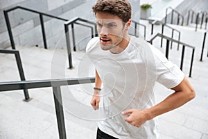 Close up of a healthy male runner in sport clothes