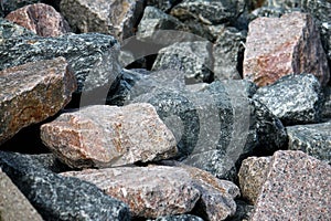 a close up of a heap of different cobblestones