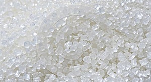 Close up heap of white sugar crystals background texture pattern