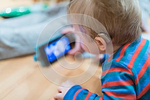 Close up on hearing aid weared by baby