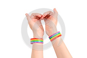 Close up of heart made by woman hands with pale skin isolated on white background. LGBT