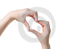 Close up of heart made by women hands with pale skin isolated