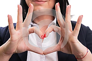 Close-up of heart symbol made by entrepreneur woman