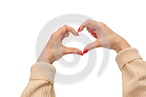 Close up of heart symbol made by woman hands with red nails isolated on white background