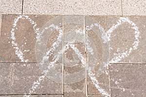 Close-up of hearts drawing with chalk on pavement as love concept