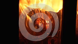 A close-up of a Heat Log Burning in a Wood Burning Stove