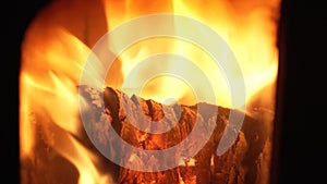 A close-up of a Heat Log Burning in a Wood Burning Stove