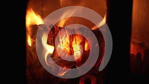 A close-up of a Heat Log Burning in a Wood Burning Stove