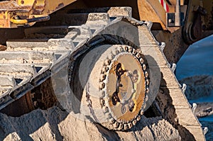 Close up of heavy machinery detail soiled with dirt and sand