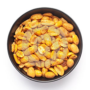 Close up of Heeng jeera Peanuts mixture Indian namkeen snacks on a ceramic black bowl.