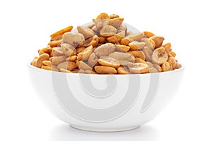 Close up of Heeng jeera Peanuts mixture Indian namkeen snacks on a ceramic white bowl.