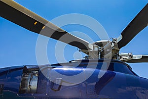 Close up of helicopter head and blades with turbine jet engine