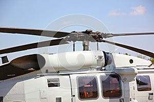 close up helicopter rotor blade parking on run way against blue sky